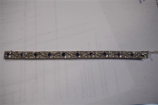 An attractive 1920s pierced white gold, sapphire and diamond bracelet, 18cm.